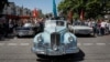 Kazakhstan - Army veterans salute as they drive in old Soviet cars during the Victory Day commemorations in Almaty, Kazakhstan May 9, 2018. REUTERS/Shamil Zhumatov
