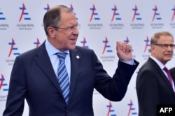 Serghei Lavrov sosind la reuniunea Asia-Europa (ASEM) din Milano, 16 octombrie, 2014.