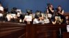 Журналисты на заседании комитета по правам человека устроили молчаливую акцию-перформанс – заняли депутатские места, надев на головы черные полиэтиленовые пакеты