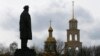 Ukraine -- A view shows a statue of Soviet state founder Vladimir Lenin in front of a cathedral in a street in Slovyansk, April 14, 2014