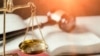 Shutterstock - Weight scales in court room library. Law old retro style photo