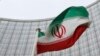 Austria -- An Iranian flag flutters in front of the International Atomic Energy Agency (IAEA) headquarters in Vienna, January 15, 2016