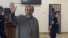 Armenia - Archbishop Mikael Ajapahian greets supporters during his trial in Yerevan, August 28, 2025.