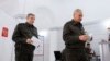 Тогашниот руски министер за одбрана Сергеј Шојгу (десно) и генералот Валери Герасимов гласаат на изборите на 15 март 2024 година.