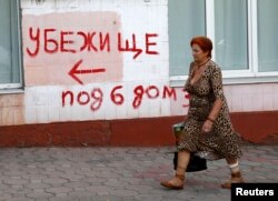 In Mariupol: "Adăpost - intrarea 6, clădirea 3".