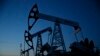 Russia -- Pump jacks are seen at the Lukoil company owned Imilorskoye oil field, as the sun sets, outside the West Siberian city of Kogalym, January 25, 2016