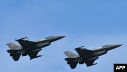 F-16 სამხედრო თვითმფრინავები უკრაინაში, Starokostyantyniv-ის სამხედრო ავიაბაზაზე, შეერთებულ შტატებთან და ნატოს სხვა ქვეყნებთან საჰაერო ძალების წვრთნების, Clear Sky 2018-ის დროს. 2018 წლის 12 ოქტომბერი