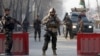 Afghanistan-Afghan security forces keep watch at a check point close to the compound of Afghanistan's national intelligence agency in Kabul, Afghanistan